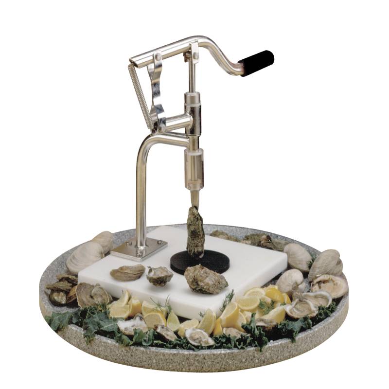 1BBB9S-EZshucker is a machine which opens oysters by hand.  The image shows an Stainless steel ezshucker surrounded by oysters while on a chefstone granite tray